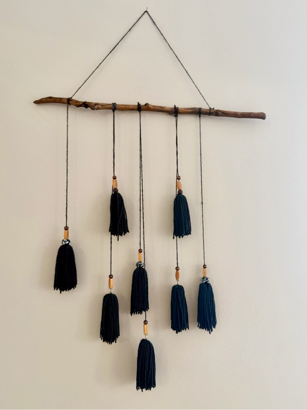 Black Tassle Boho Chic Wall Hanging on Wood